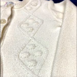 White cardigan with beautiful knit designs